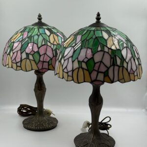 Pair of Tiffany style table lamps with decorative glass shades and bronze bases