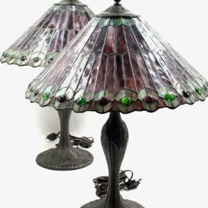 Pair of Tiffany style antique table lamps with colored glass shades and bronze decorative bases