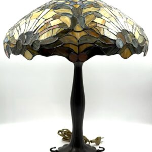 Tiffany style table lamp with decorative glass shade and bronze relief base