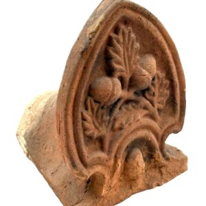 Ceramic architectural acroterion with acorn and leaf motif.