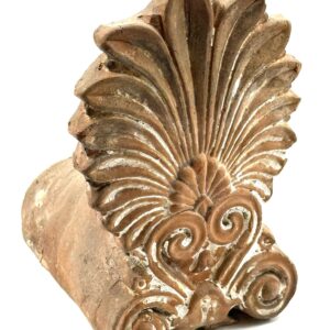 Ceramic architectural antefix with anthemion and symmetrical scroll motifs.
