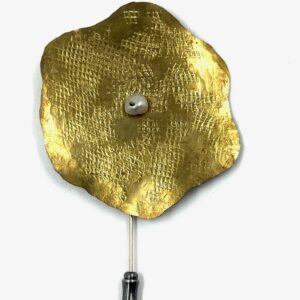 Bronze brooch with artist signature.