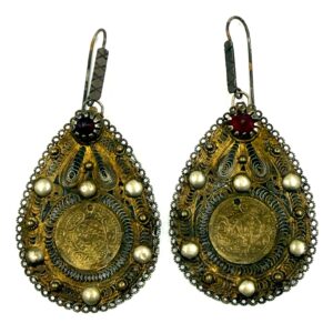 Traditional filigree earrings with Ottoman coin and red decorative stone.
