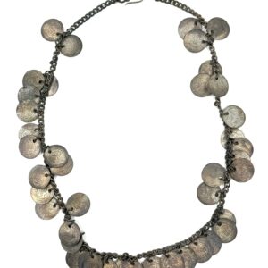 Traditional jewelry with hanging coin decorations.