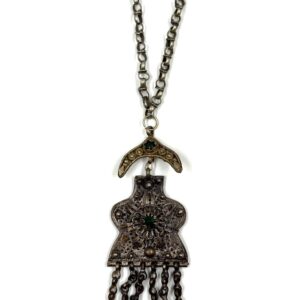 Traditional filigree pendant with decorative stones and coin details.